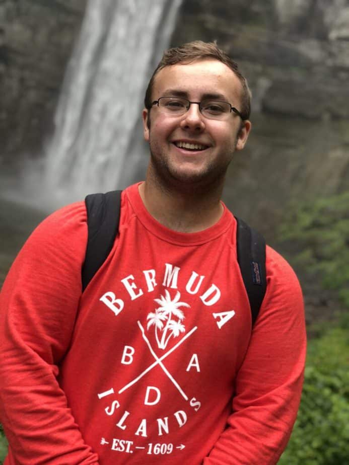 michael standing in front of a waterfall